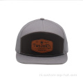 7 paneel snapback cap met lederen patch